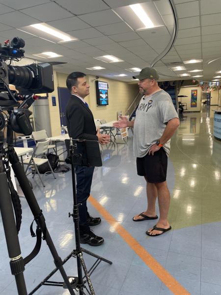 Interviewing a voter on primary day