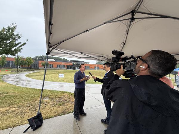 A live shot under a rain tent outside an Anne Arundel County polling location